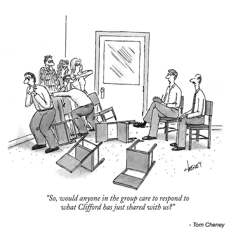 A group of people awkwardly reacts to a speaker, with overturned chairs and a door in the background.